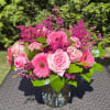 Elegantly crafted with an array of pink and green blooms.
Bloom Details: Gerbera