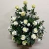 White rose arrangement in a tall pedestal vase