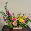 A contemporary crescent design in a pastel washed wooden box filled with