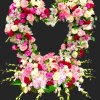 Heart-shaped floral arrangement of pink, white, and red roses