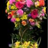Tall mixed flower arrangement in a rectangular bark-textured container
