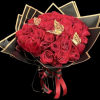 Bouquet of red roses wrapped in black paper with gold trim