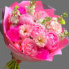 Pink bouquet of peonies and carnations wrapped in bright pink paper