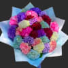 Bouquet of multicolored carnations wrapped in pale blue paper