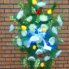 Standing floral spray with white blooms, yellow roses, and blue ribbon