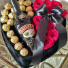 Heart-shaped gift box with pink roses, Ferrero Rocher chocolates, and a Baileys bottle