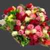 Large bouquet of red, pink, and white roses with mixed filler flowers