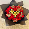 Red roses arranged with gold-wrapped chocolates in black paper