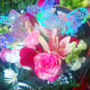 Bouquet of pink and red roses with lilies and white daisies, decorated with butterfly picks