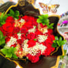Bouquet of red roses with white filler and butterfly decorations