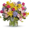 Spring has surely sprung with this lush arrangement of vibrant colors, dimensional