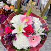 Bouquet of pink roses, white lilies, and pink gerbera daisies