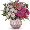 Pink and white mixed bouquet in a pink textured vase