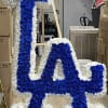 Blue and white floral letter display on a stand