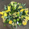 Yellow lilies and roses with green button mums in a bouquet