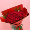 Large bouquet of red roses wrapped in red paper