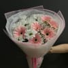 Bouquet of pink and white gerbera daisies wrapped in pink paper