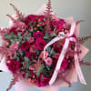 Bouquet of pink and magenta roses with eucalyptus and pink filler flowers