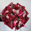 This hand-tied bouquet is a perfect blend of passion and tenderness, making