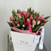 Experience the vibrant beauty of spring with our mixed bouquet of tulips.