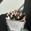 Pink tulip bouquet in a white gift bag