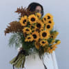 Bouquet of yellow sunflowers with brown filler flowers