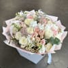 Bouquet of pale pink and white roses with small white blooms