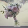 Pink and white bouquet with roses and ruffled blooms