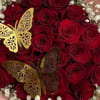 Bouquet of red roses with white baby's breath and gold butterfly accents