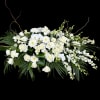 White floral arrangement with roses, orchids, and chrysanthemums
