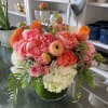 Our Jubilee arrangment is in a 5x6 clear cylinder vase filled with