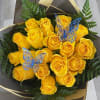Bouquet of yellow roses with fern foliage and butterfly picks