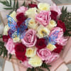 Bouquet of pink, red, and white roses with blue butterfly picks
