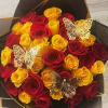 Bouquet of red and yellow roses with butterfly decorations
