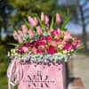 Romantic combination of Spray Roses, Tulips and Gerbera Daisies, surrounded with pastel
