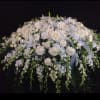 Large white floral spray with roses and lilies