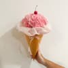 Pink carnation bouquet in a waffle cone with a cherry topper