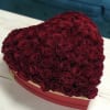 Heart-shaped box filled with red roses