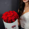 Bouquet of red roses in a white hatbox