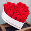 Heart-shaped box filled with red roses