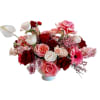 Pink and red rose arrangement in a low vase