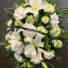 White lilies and roses with pale green mums in a floral spray