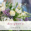 White and lavender floral arrangement with mixed blooms and greenery