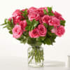 Pink rose bouquet in a clear glass vase
