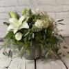 White lily and rose arrangement in a gray vase