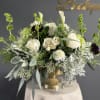 A naturally refined arrangement that blends soft whites and fresh greens for