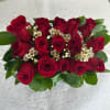 This bold and romantic arrangement is all about passion! Deep red roses