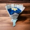 Bouquet of blue and white roses wrapped in white paper with a ribbon