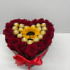 Heart-shaped box of red roses with a sunflower and gold chocolates