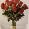 Bouquet of red roses in a clear glass vase